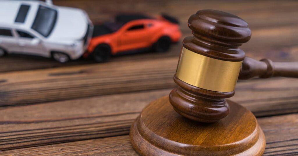 Gavel and toy car representing New Jersey PIP and no-fault auto insurance law
